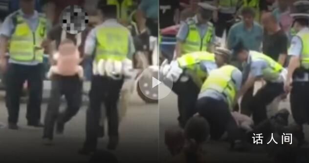 男子怀抱婴儿骑车与交警起冲突 已带回警局